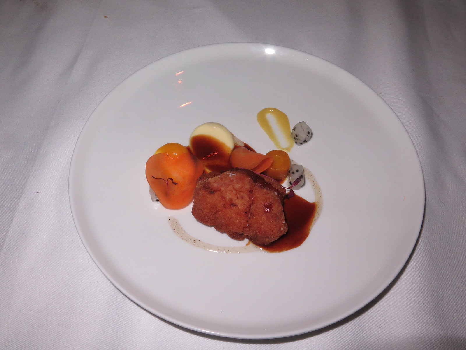 “Calf's sweetbread with lemon and yuzu, texture of carrots, jus of lemongrass with combava”