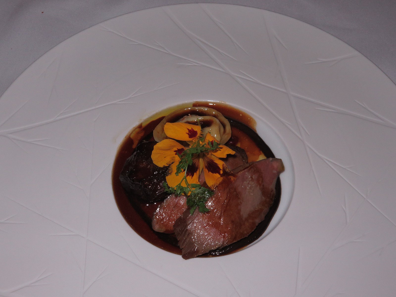 “Slow cooked shoulder & loin of lamb, piperade and goat's cheese ravioli”