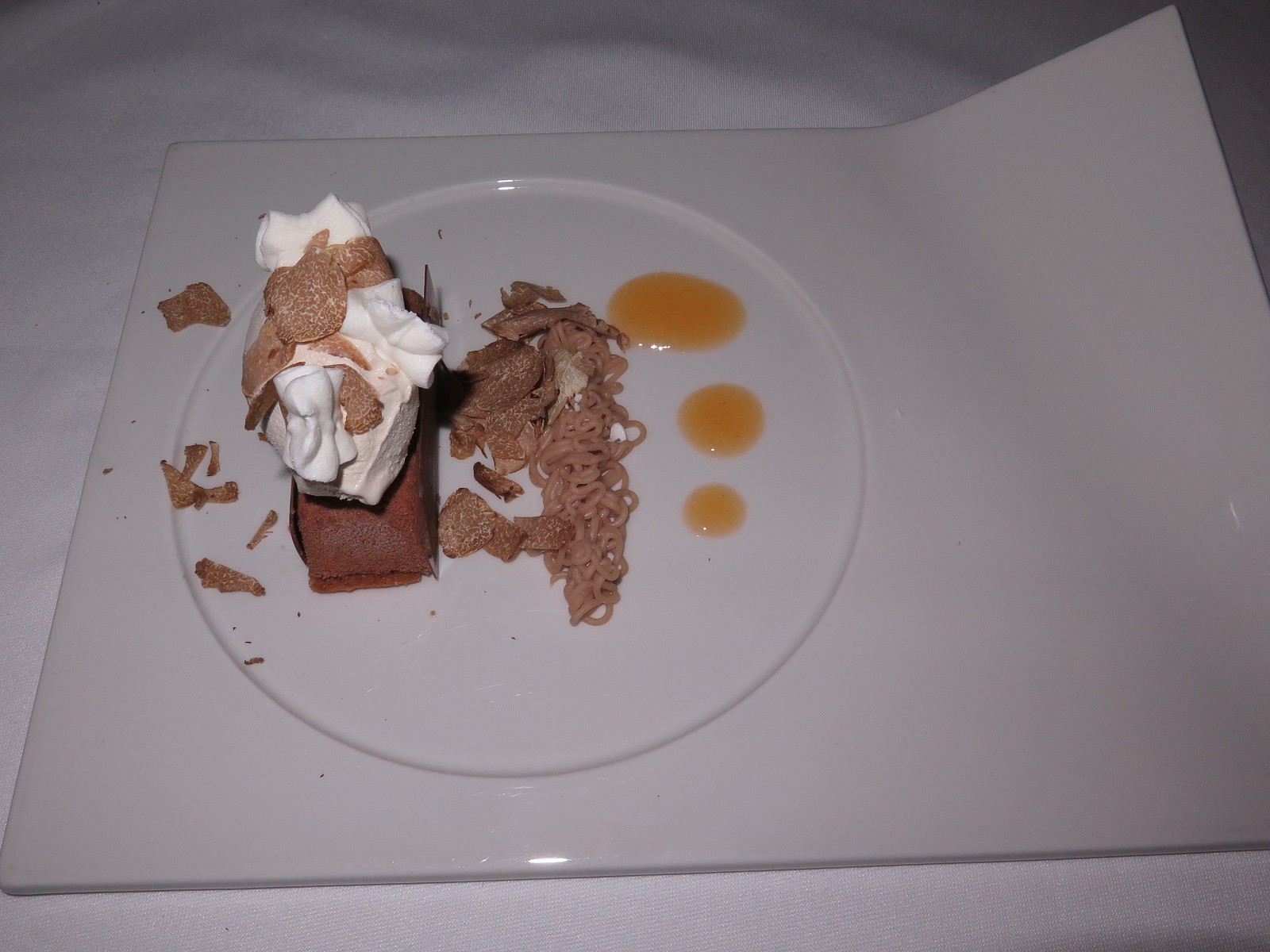 “Interpretation of a coffee Mont Blanc, with persimmons and white truffle”