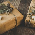 photo-of-two-brown-wrapped-gifts-on-wooden-table-1693650.jpg